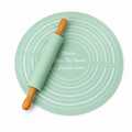 Representative Green round pastry mat and wood-handle rolling pin on white