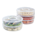 Original representative round food containers with lids and handles on white